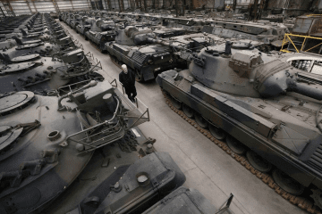 Rows of Leopard 2A4 main battle tanks undergo refurbishment at Rheinmetall’s facility in Unterlüß, Germany, before delivery to Ukraine. (Source: Rheinmetall)