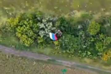 Russian “soldier” waving a flag reportedly in Bilyi Kolodyaz in the Vovchansk direction, July 2026.