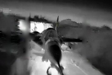 A Russian MiG-29 fighter jet at Belbek air base in occupied Crimea before being struck during a Ukrainian HUR drone operation. (Source: HUR)