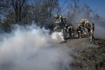 Recruits, supervised by instructors, cover a distance on Day Zero of Basic Military Training at the 118th Separate Mechanised Brigade of the Ukrainian Armed Forces on April 5, 2026. (Source: Getty Images)