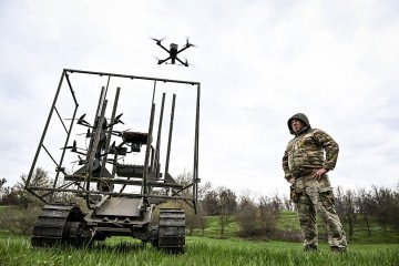 A soldier with the call sign ''Pavuk'' (''Spider'') watches a drone take off from a ground robotic complex during trials at a training ground on April 10, 2026. (Source: Getty Images) A soldier with the call sign ''Pavuk'' (''Spider'') watches a drone take off from a ground robotic complex during trials at a training ground on April 10, 2026. (Source: Getty Images)