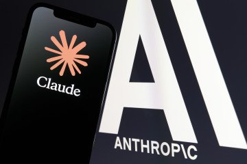 Claude app logo is seen on a smartphone screen in front of the Anthropic logo displayed on a monitor in this illustration photo taken in San Ferdinando di Puglia, Italy, on October 27, 2026. (Source: Getty Images)