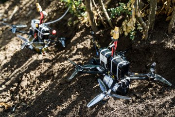 Ukraine Unveils Drone-Assault Units, Integrating Robots and Infantry on the Battlefield FPV Drones with a shell attached to them lying on the ground. (Source: Getty Images)