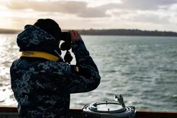 A Ukrainian sailor scans the Solent through binoculars during Exercise Lion Protector off England’s southern coast. (Source: Royal Navy) A Ukrainian sailor scans the Solent through binoculars during Exercise Lion Protector off England’s southern coast. (Source: Royal Navy)