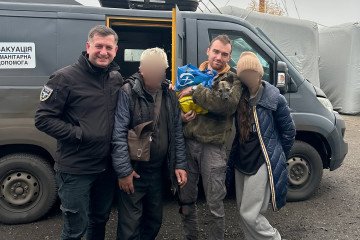 Evacuation volunteers stand with two residents and their dog after safely bringing them out of a frontline area in Donetsk on November 12, 2025. (Source: Diana Yakovleva/Instagram)