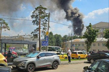 A thick column of black smoke rises over the TsNIIMash space research center in Korolev, Moscow suburb, during a major fire. (Source: social media)