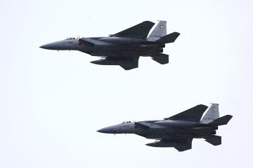 A pair of Japan Air Self-Defense Force F-15 fighter jets perform a flypast during a review parade as part of the National Defense Academy Entrance Ceremony in Yokosuka, Kanagawa Prefecture on April 5, 2026. (Source: Getty Images) A pair of Japan Air Self-Defense Force F-15 fighter jets perform a flypast during a review parade as part of the National Defense Academy Entrance Ceremony in Yokosuka, Kanagawa Prefecture on April 5, 2026. (Source: Getty Images)