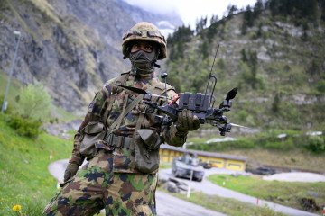 A Swiss soldier controls an FPV drone. (Source: Getty Images)