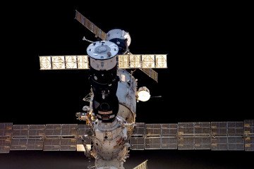 Russia Plans to Trigger “Space Pearl Harbor” With Nuclear Anti-Satellite Weapons, US General Warns Solar arrays and two Russian spacecraft docked to the International Space Station prior to its docking with the orbital outpost on day three of the shuttle's mission July 6, 2006. Illustrative photo. (Source: Getty Images)