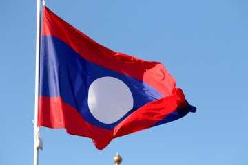 The flag of the Laos People's Democratic Republic seen in the gallery of flags of the participating countries in the framework of St. Petersburg International Economic Forum 2024.
