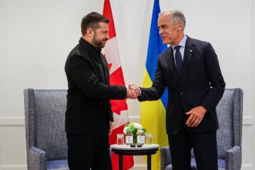 Ukrainian President Volodymyr Zelenskyy and Canadian Prime Minister Mark Carney shake hands as they meet in Calgary, Alberta, on September 10, 2026. (Source: Getty Images)
