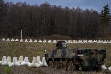 Polish armored vehicles and anti‑tank defenses are deployed at a newly constructed section of the East Shield fortifications near Poland’s border with Russia in Dąbrówka, Poland, on November 30, 2024. (Photo: Getty Images)