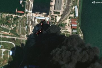 Vantor satellite image shows burning storage tanks and heavy smoke following attacks in Kerch on June 20, 2026. (Source: Getty Images)