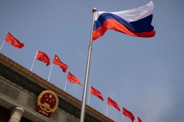 The Russian national flag fluters in front of the Great Hall of the People before a welcoming ceremony for Russian Prime Minister Mikhail Mishustin in Beijing on May 24, 2023. (Source: Getty Images)