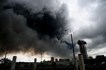 Black smoke rises from the refinery where a fire broke out following a strike as firefighting efforts continue in Moscow, Russia on June 18, 2026. (Source: Getty Images)