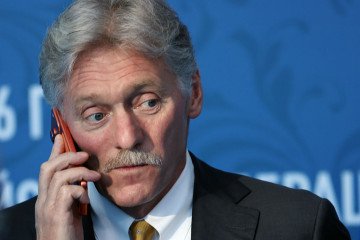 Russian Presidential Press Secretary Dmitry Peskov speaks on a mobile phone during a Russian-Kazakh forum, on July 25, 2026, in Omsk, Russia. (Source: Getty Images)