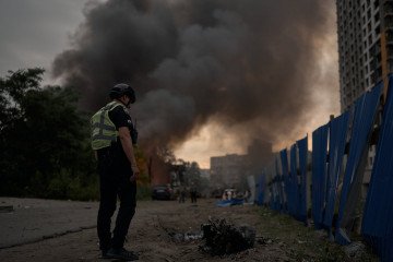 Ukraine’s Defense Minister Calls for Patriot Missile Transfers After Russia’s Latest Mass Attack A Ukrainian police officer inspects missile debris following a Russian ballistic missile strike on Kyiv, July 6, 2026. (Source: Getty Images)