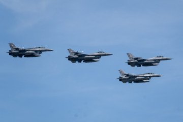 Polish Air Force F-16 Fighting Falcon fighter jets fly in formation over the city during the Polish Armed Forces Day military parade in Warsaw, Poland, on 15 August 2026. ( Polish Air Force F-16 Fighting Falcon fighter jets fly in formation over the city during the Polish Armed Forces Day military parade in Warsaw, Poland, on 15 August 2026. (