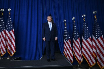 US President Donald Trump arrives to deliver remarks at McDonald’s Impact Summit in Washington, DC, on November 17, 2025. (Source: Getty Images)