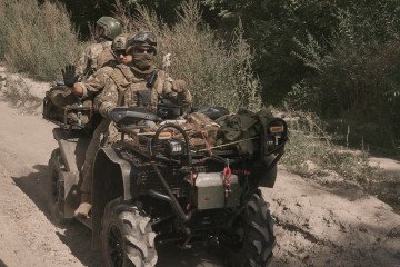 Ukrainian soldiers of the 47th Separate Mechanized Brigade ride ATVs toward frontline positions in Sumy region on August 28, 2026. (Source: Getty Images)