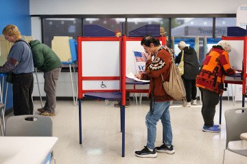 People fill their ballots during the first day of early voting for the midterm elections in Minneapolis, Minnesota, on October 16, 2026. (Source: Getty Images) People fill their ballots during the first day of early voting for the midterm elections in Minneapolis, Minnesota, on October 16, 2026. (Source: Getty Images)