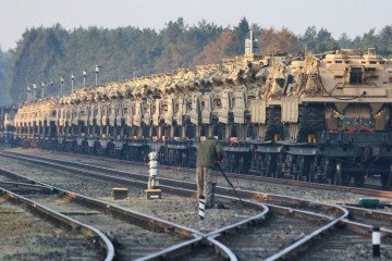 M88 Hercules service vehicles and Abrams tanks are seen at the railway station near the Pabrade military base in Lithuania, on October 21, 2019. (Source: Getty Images)