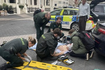 Rescuers helping the injured man after a Ukrainian medics team passed him to them, London, UK. (Source: Third Army Corps)
