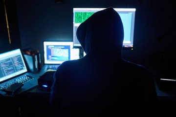 Illustrative image: fictitious html pages and hacker programs are seen on screens while a man has his hands on the keyboard. (Source: Getty Images) Illustrative image: fictitious html pages and hacker programs are seen on screens while a man has his hands on the keyboard. (Source: Getty Images)
