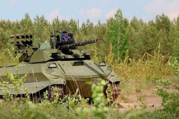 Russian Uran-9 unmanned ground combat vehicle equipped with a remote-controlled cannon and anti-tank missiles during field deployment. (Source: Russian media)