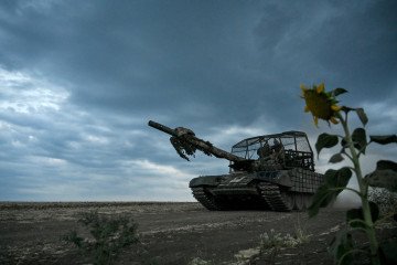 Tankers of the 118th Separate Mechanized Brigade drive a T-72 tank during the live-fire exercise in the Zaporizhzhia region, southeastern Ukraine, July 21, 2024.