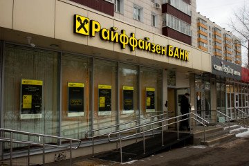 A man walks out of a Raiffeisen Bank office in Moscow, Russia. (Source: Getty Images)
