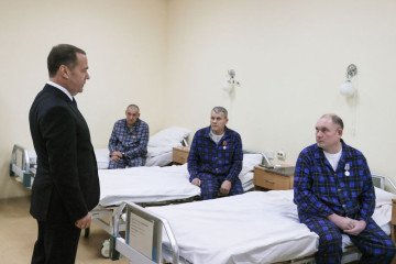 Russia’s Security Council Deputy Chairman Dmitry Medvedev visits participants of the Russian invasion of Ukraine, who are undergoing rehabilitation at the Republican Clinical Hospital for War Veterans, in Ufa on December 24, 2024. (Source: Getty Images)