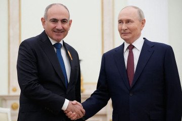 Russian leader Vladimir Putin (R) greets Armenian Prime Minister Nikol Pashinyan prior to their meeting at the Kremlin in Moscow, on April 1, 2026. (Source: Getty Images)