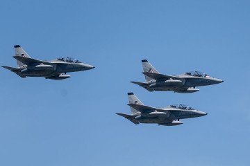 Polish Air Force Leonardo M-346 Bielik jet trainer aircraft fly in formation over the city during the Polish Armed Forces Day military parade in Warsaw, Poland on 15 August 2026. (Source: Getty Images)