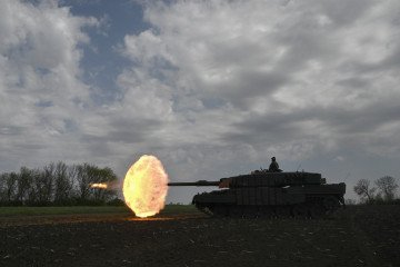 A Ukrainian tank crew of the 33rd Separate Mechanized Brigade fires a round from a Leopard 2A4 tank during a field training exercise on April 30, 2025. A Ukrainian tank crew of the 33rd Separate Mechanized Brigade fires a round from a Leopard 2A4 tank during a field training exercise on April 30, 2025.