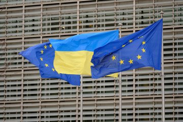 EU and Ukrainian flags fly in the wind in front of the Berlaymont, the EU Commission headquarter in Brussels, Belgium. (Source: Getty Images)