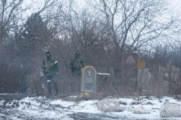 Russian soldiers at the cemetery in Donetsk, Ukraine, on March 10, 2022.