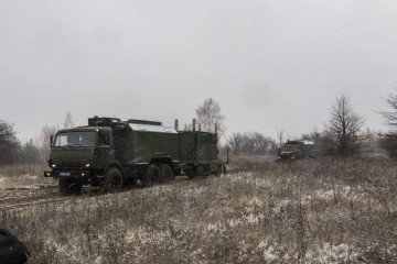 Russian R-330Zh “Zhitel” electronic warfare system mounted on a KamAZ military truck moving through a field during a deployment exercise. (Photo: Open sources)