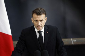 French President Emmanuel Macron delivers a speech beside the nuclear-powered ballistic missile submarine Le Téméraire (S617) during his visit to the Île Longue naval base in Crozon, northwestern France, on March 2, 2026. (Source: Getty Images)