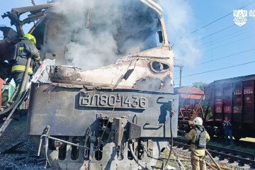 Firefighters inspect the damaged locomotive of a passenger train after a Russian drone strike in Odesa region on August 13, 2026. (Source: Odesa Regional Military Administration head Oleh Kiper)