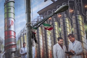A banner in downtown Tehran shows Iran’s Natanz facility and nuclear scientists, with the phrase “Science is power.” August 28, 2025. (Source: Getty Images)