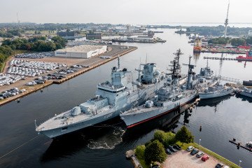 Frigate Baden-Württemberg moored beside the former destroyer Mölders, now a museum ship, at Wilhelmshaven Naval Base. (Source: Getty Images)