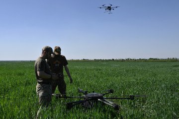 Ukrainian servicemen of the “Achilles” Battalion from the 92nd Brigade of the Ukrainian Army prepare to run test flights with a Vampire hexacopter drone ahead of missions, in the eastern Donetsk region on April 30, 2024. (Source: Getty Images)