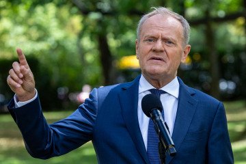 Poland’s Prime Minister Donald Tusk speaks to the press during a press conference in the gardens of the Prime Minister’s Chancellery building in Warsaw, Poland, on July 3, 2025. (Source: Getty Images)