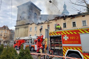Firefighters extinguish a fire on building in center of city after Russian drone attack on March 24, 2026 in Lviv, Ukraine. (Source: Getty Images)