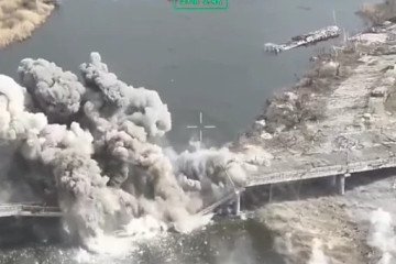 Explosion tears through a bridge structure during a Ukrainian drone strike, with debris and smoke rising over a river crossing. (Photo: Open source)