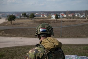 A Dutch soldier looks out onto the military training city of “Schnöggersburg,” during Bastion Lion military exercise on April 09, 2025, near Gardelegen, Germany.