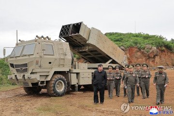 North Korean leader Kim Jong Un observes a newly developed lightweight multi-purpose missile launcher and a tactical cruise missile weapons system. (Source: Yonhap)
