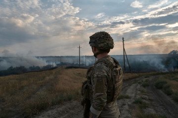 A soldier looks at a fire caused by artillery fire on July 29, 2024 in Donetsk region, Ukraine. (Source: Getty Images) A soldier looks at a fire caused by artillery fire on July 29, 2024 in Donetsk region, Ukraine. (Source: Getty Images)