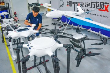 An employee works on the production line of drones at a workshop of an aerial technology company on July 9, 2025, in Anqing, Anhui Province of China. (Source: Getty Images)